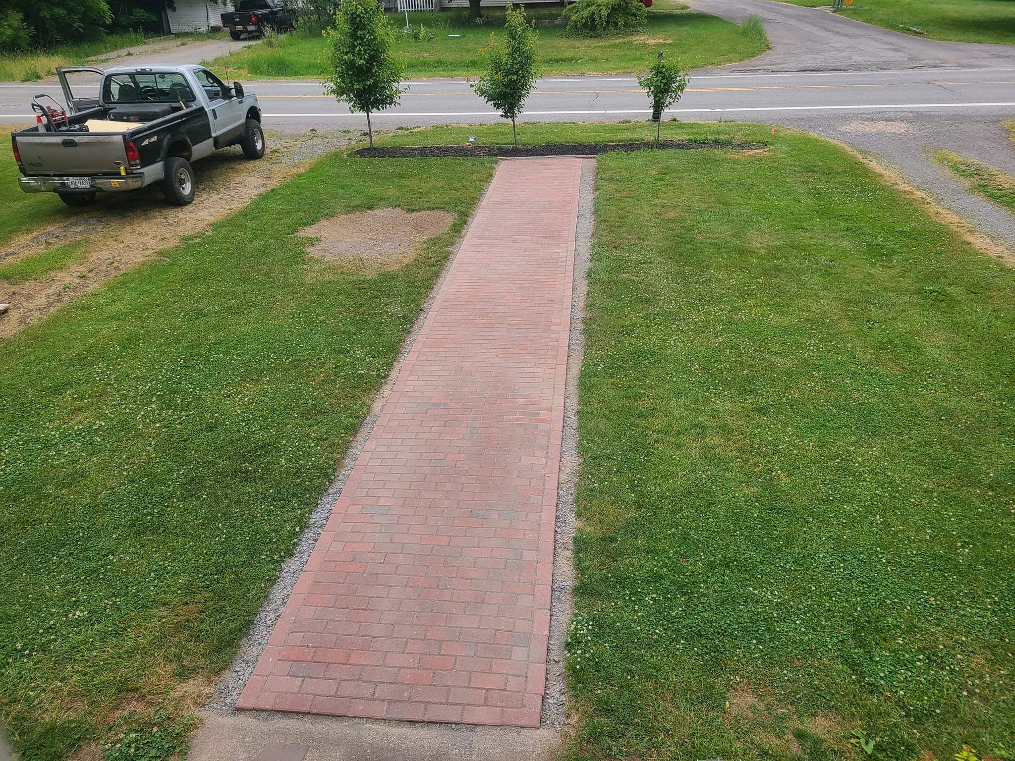 Brick path installation project completed by Diamond Landscape & Design.