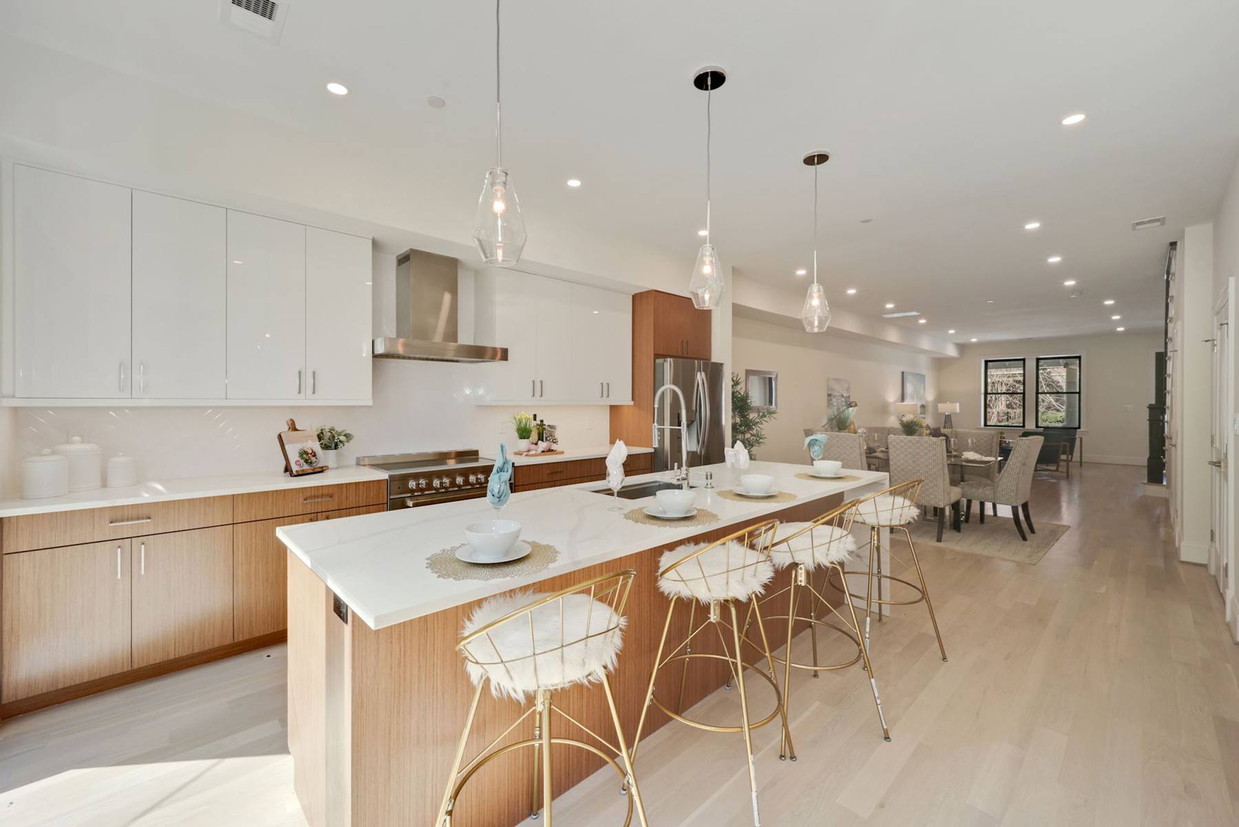 Modern European rowhouse kitchen with sleek cabinetry and contemporary design features