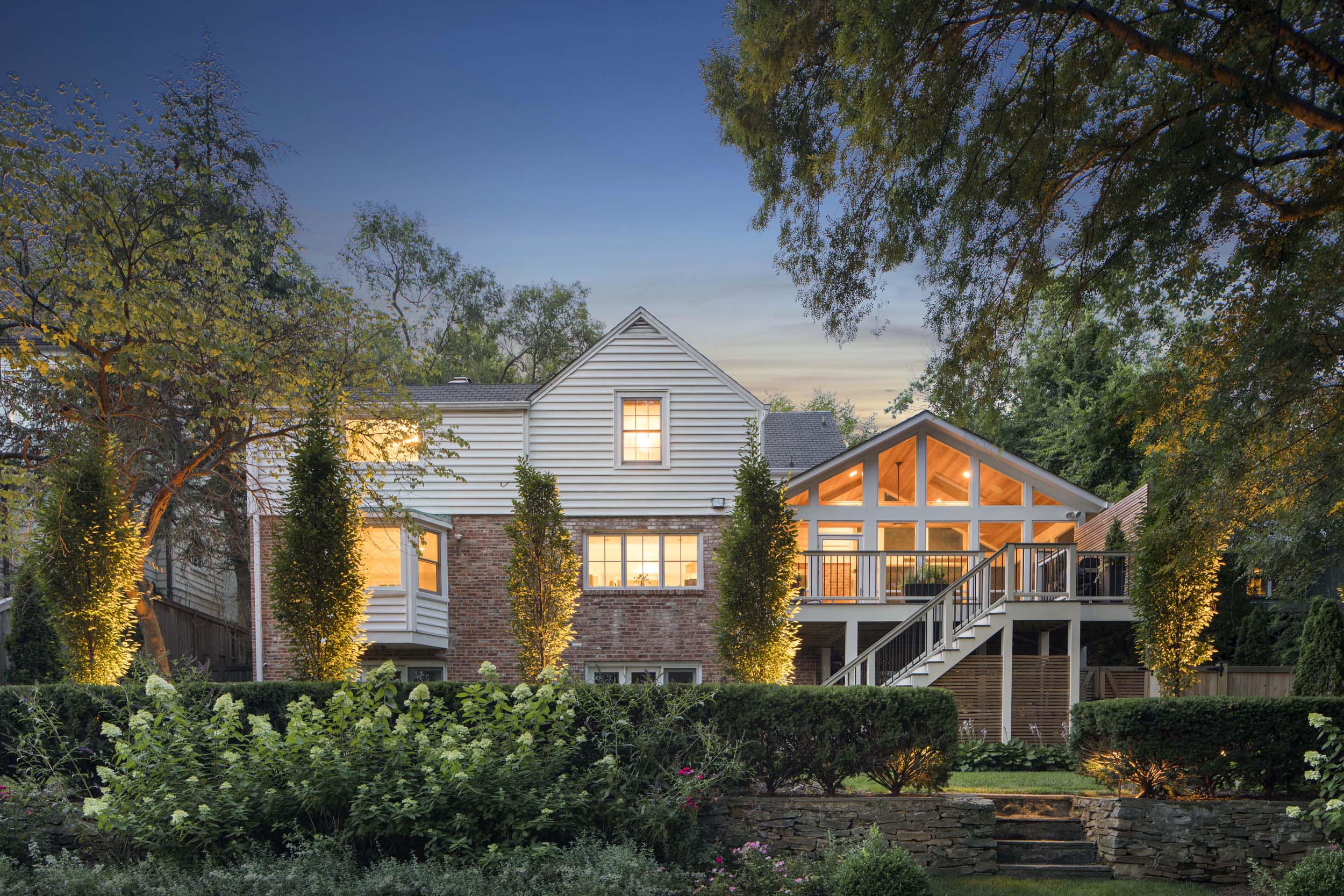 Elegant home exterior with professional landscaping and architectural details