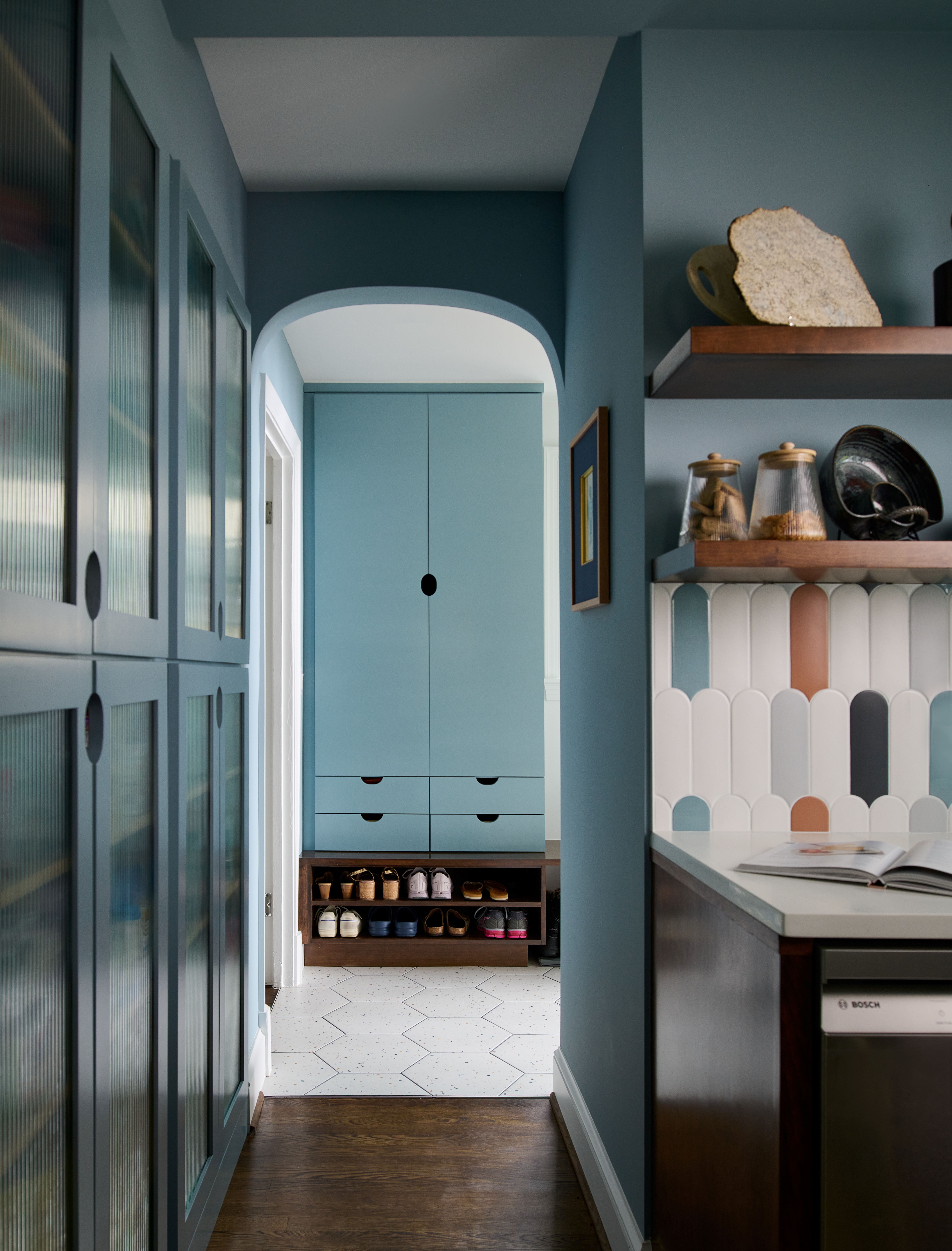 Transition space between kitchen and living areas with consistent design theme