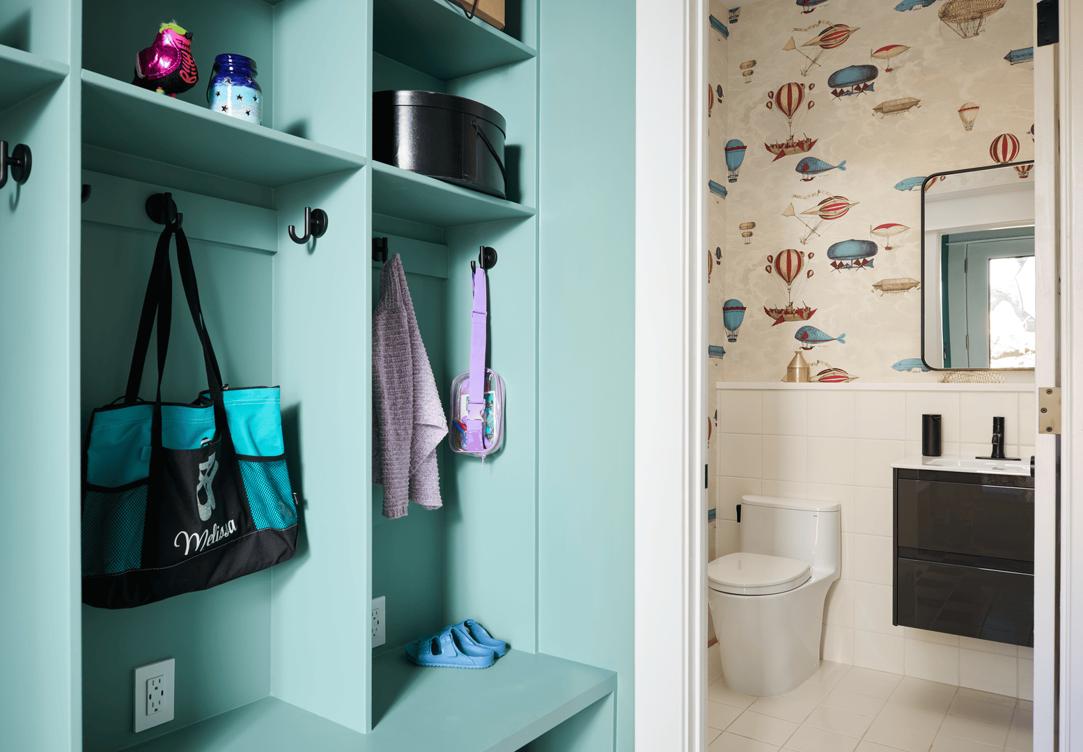 Wider view of powder room showing the relocated layout and bold design elements