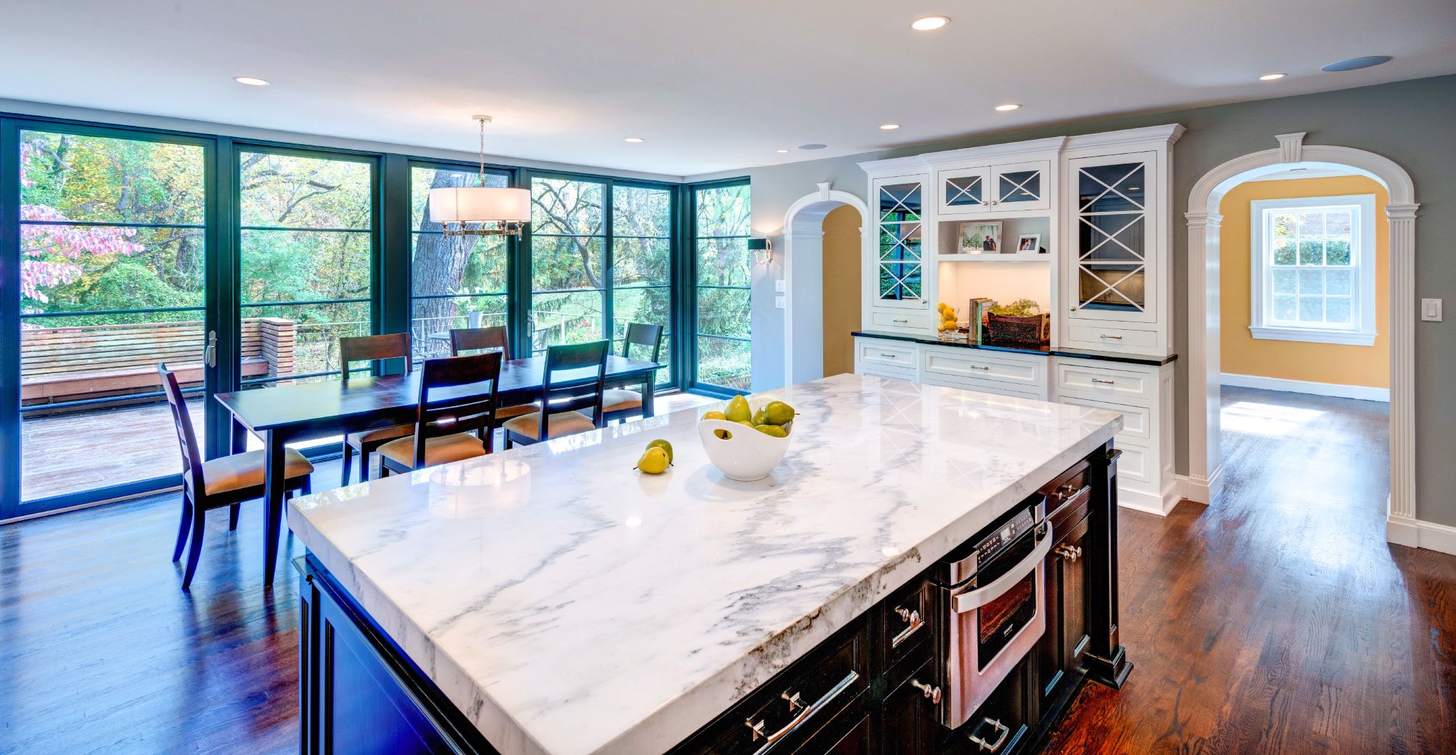 Renovated Georgetown kitchen with expansive windows maximizing natural light and park views