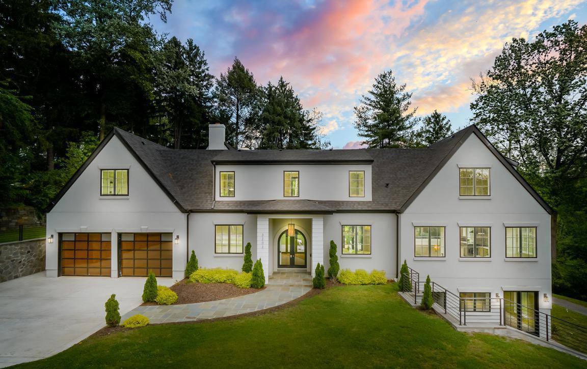 Front view of modernized Cape Cod home showcasing dramatic architectural transformation with clean lines and contemporary design