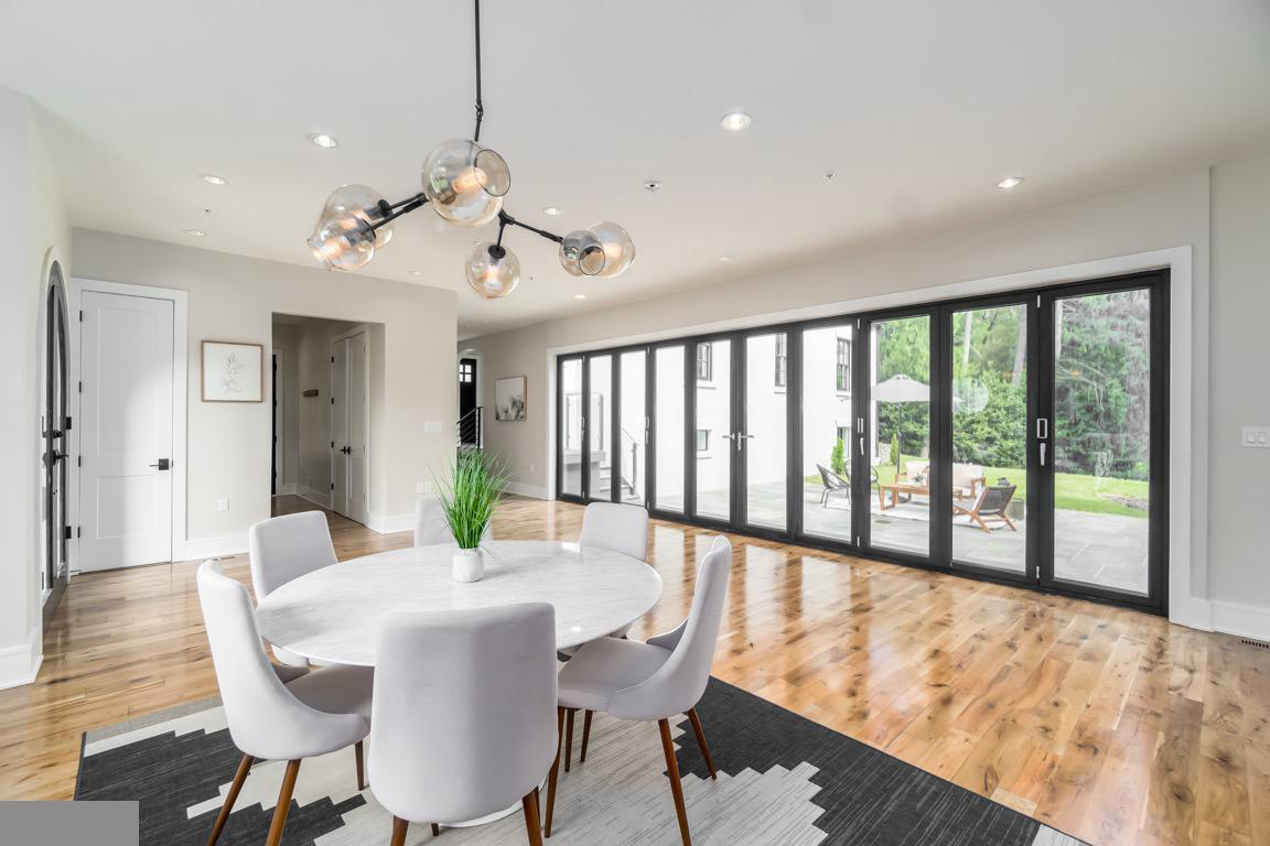 Modern living space featuring clean lines, minimalist furnishings, and strategic lighting in renovated Chevy Chase home