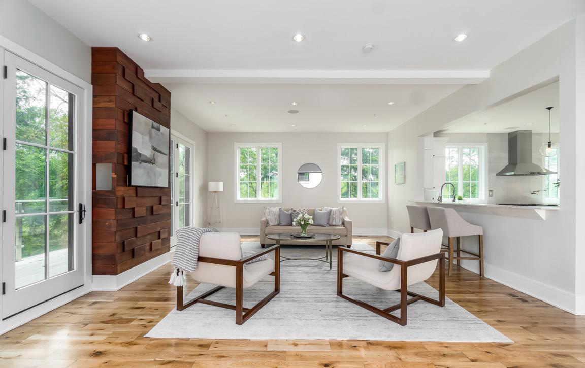Hallway with built-in storage solutions, recessed lighting, and contemporary finishes