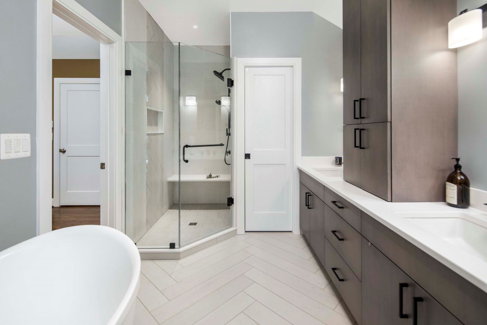 Elegant primary bathroom featuring custom millwork, luxurious fixtures, and sophisticated design elements in Upper Chevy Chase home