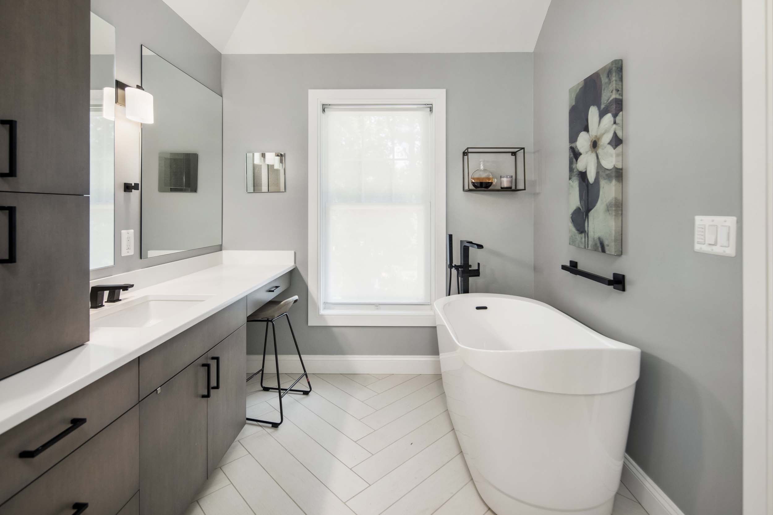 Spacious walk-in shower with premium tile work, glass enclosure, and high-end fixtures