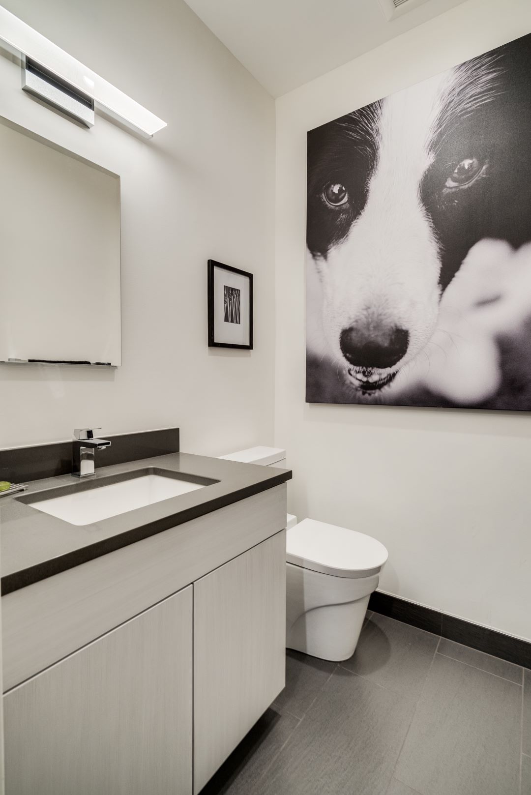 Wide view of primary bathroom showing expanded layout and seamless flow between bathroom elements