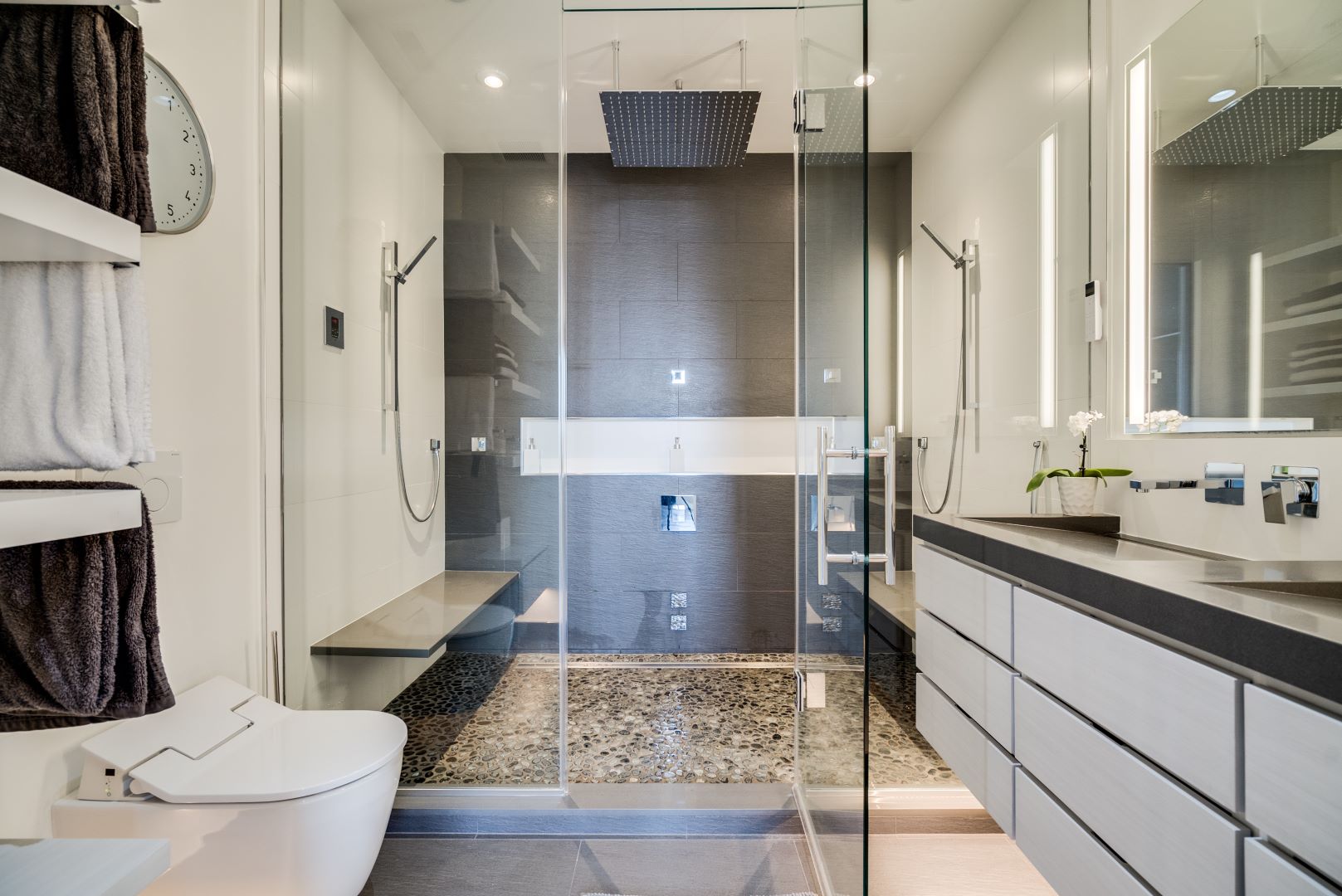 Modern primary bathroom with floating vanity, minimalist design, and contemporary fixtures in Logan Circle loft space