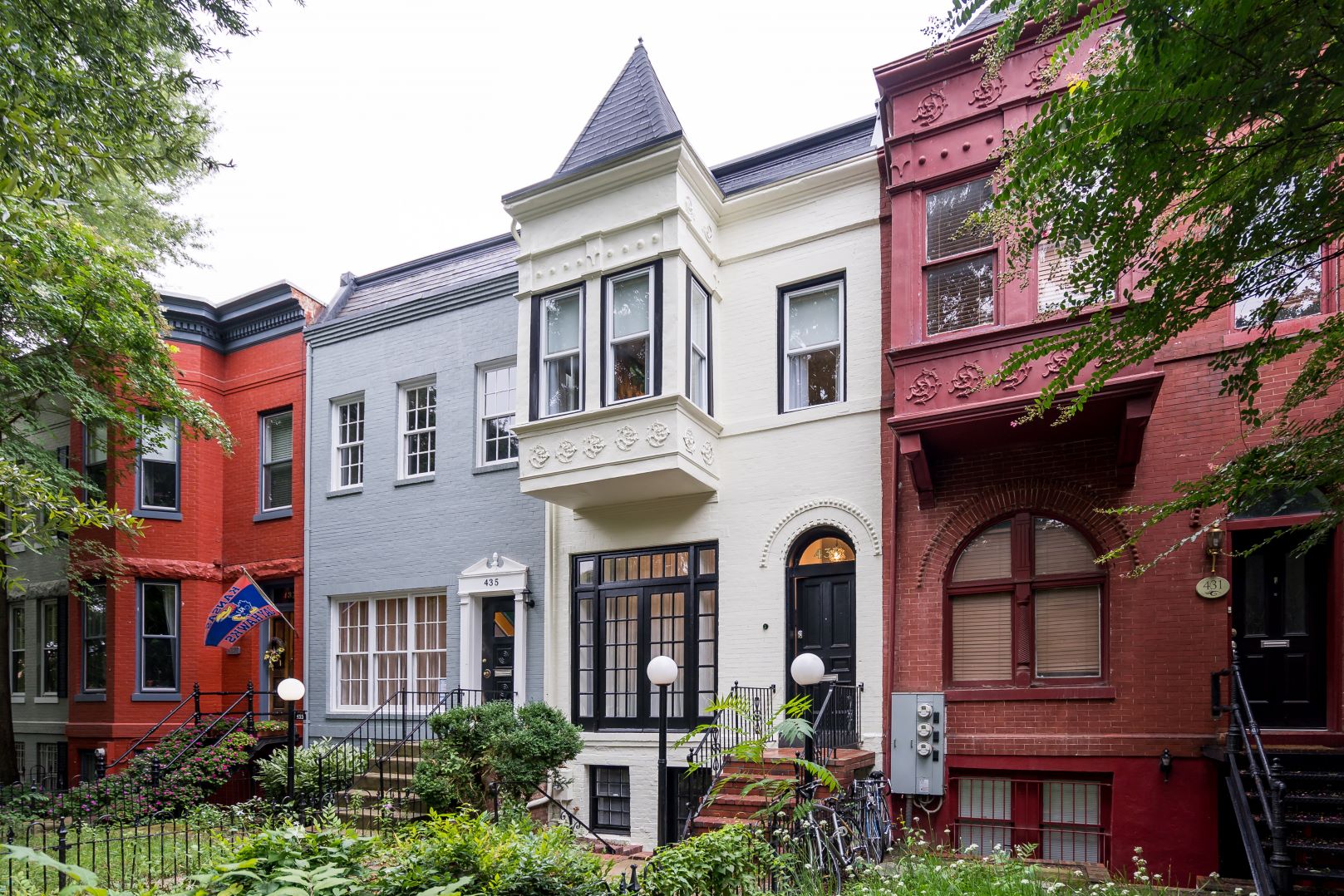 Fully renovated historic Capitol Hill rowhouse exterior featuring preserved architectural elements and meticulous restoration of period details