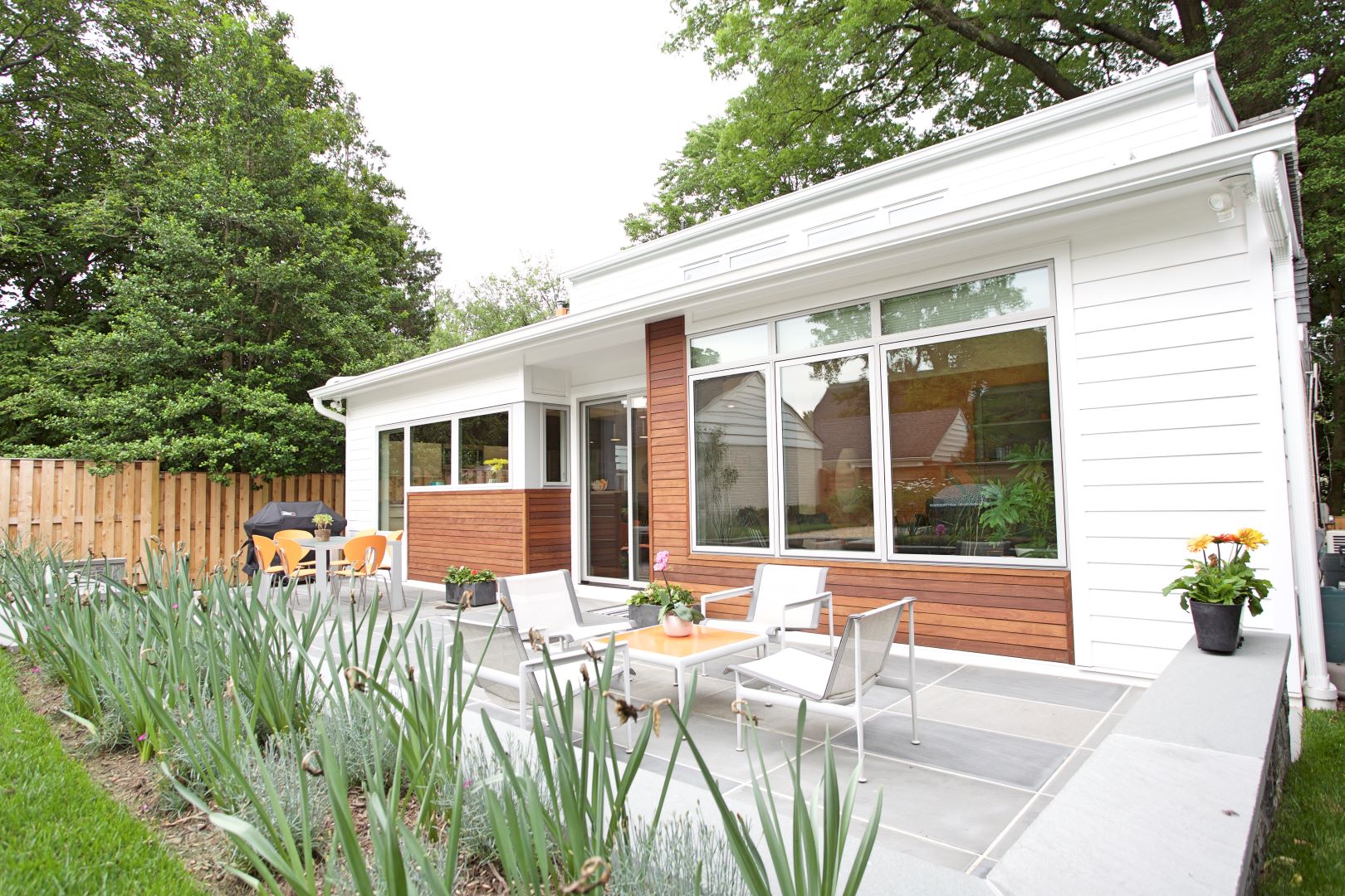 Exterior view highlighting architectural details and mid-century modern design influences in renovated home