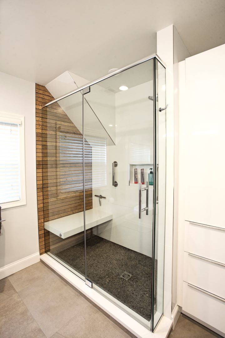 Transformed bathroom with mid-century modern aesthetic featuring clean lines, quality materials, and thoughtful design in Cape Cod home renovation