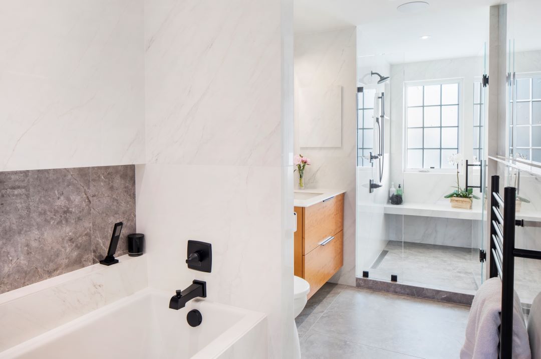 Modern, accessible bathroom in converted attic space with universal design features for aging in place and elegant finishes