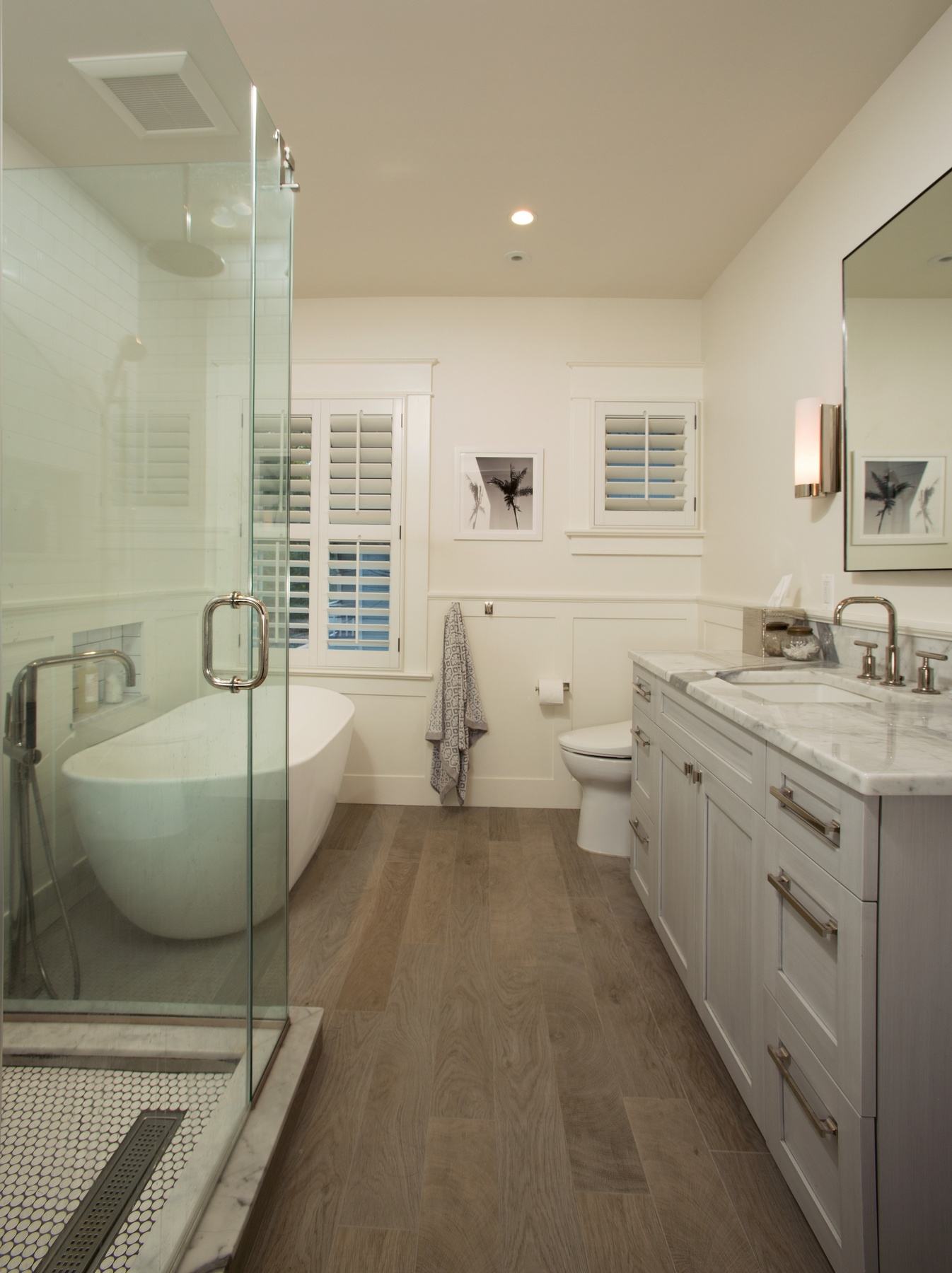 View of bathroom showing thoughtful layout improvements while maintaining historic architectural integrity