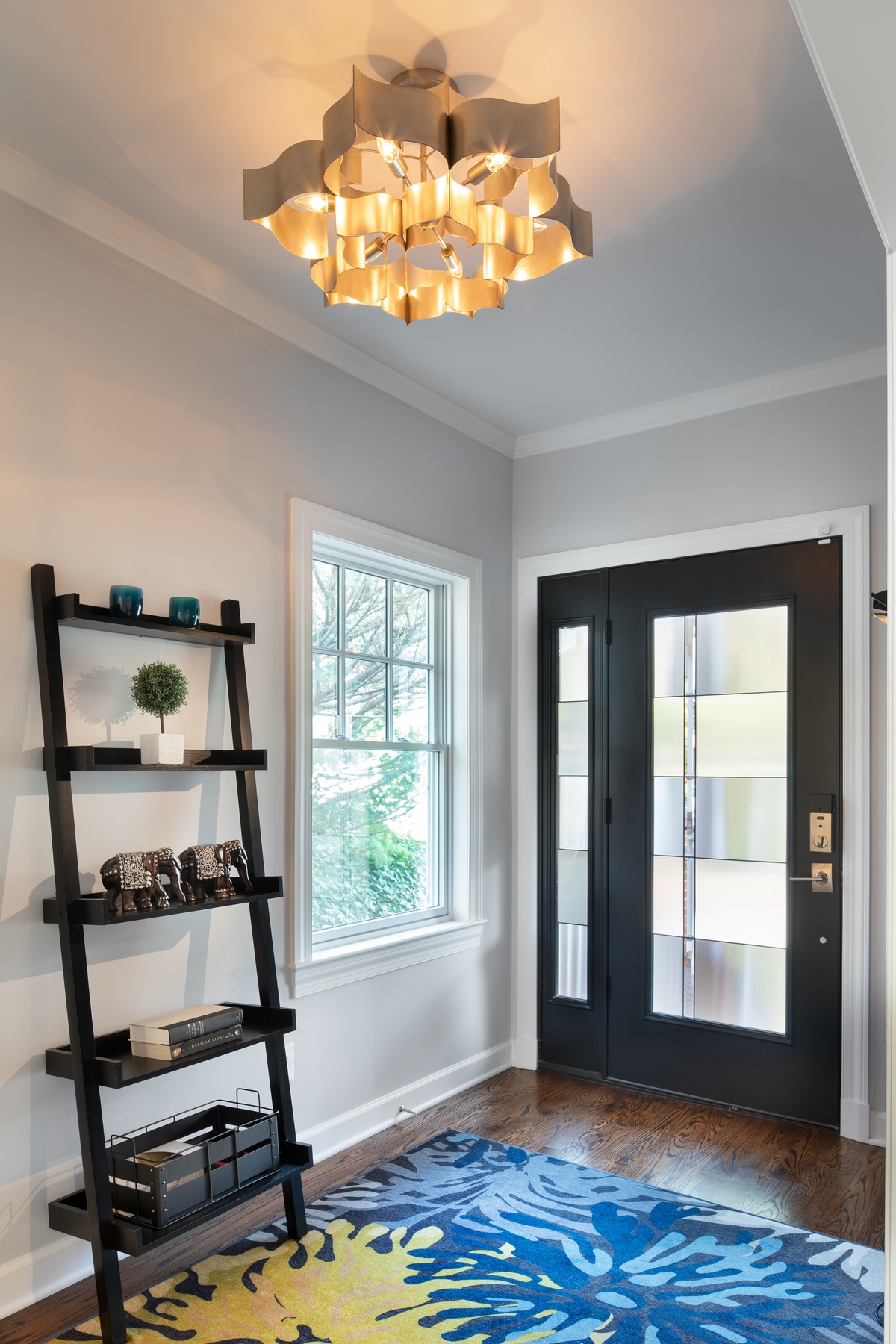 Kitchen island with seating, functional workspace, and relationship to dining area in transformed Chevy Chase home