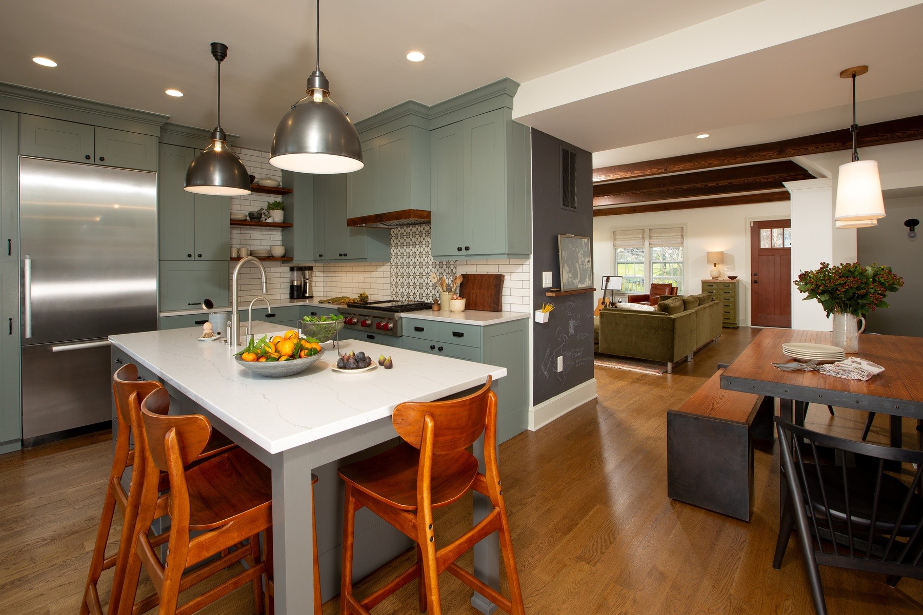 Detail of kitchen cabinetry highlighting quality craftsmanship, thoughtful storage solutions, and designer hardware