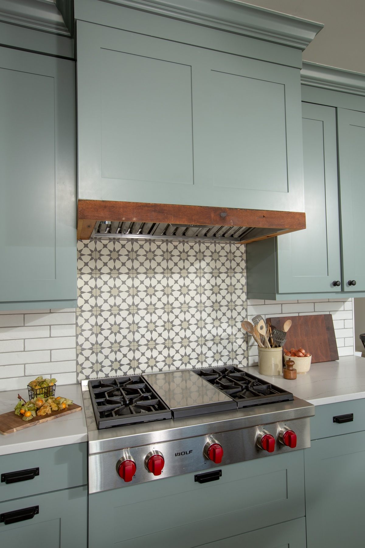 Kitchen island with wood top, comfortable seating, and thoughtful lighting creating focal point for family gatherings