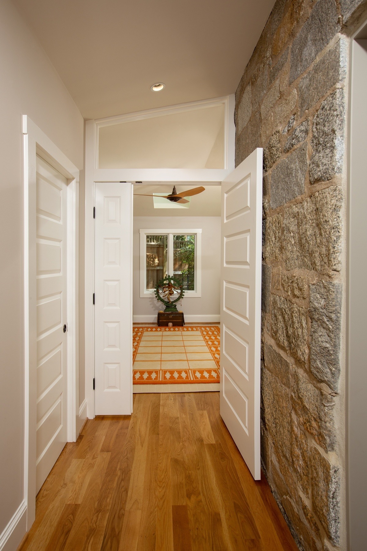 Elegant home office space with built-in shelving, abundant natural light, and seamless integration with 1926 Crestwood home