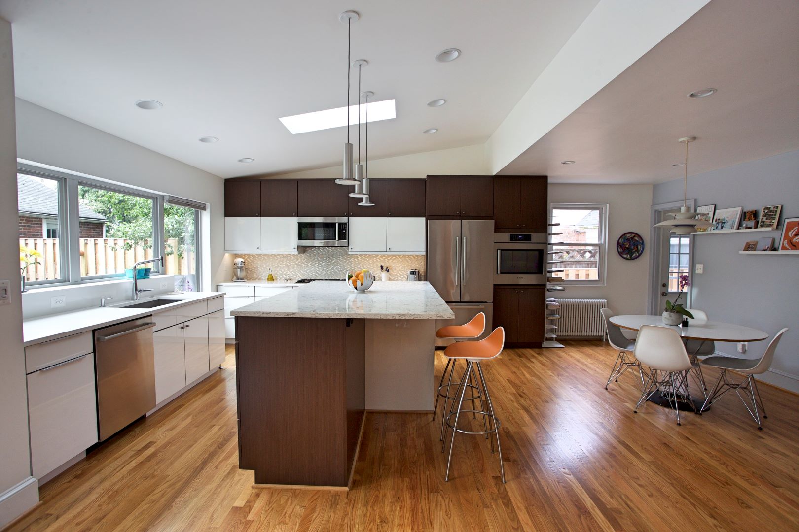 Kitchen view showcasing sleek cabinetry, contemporary fixtures, and thoughtful integration with living space in Silver Spring home
