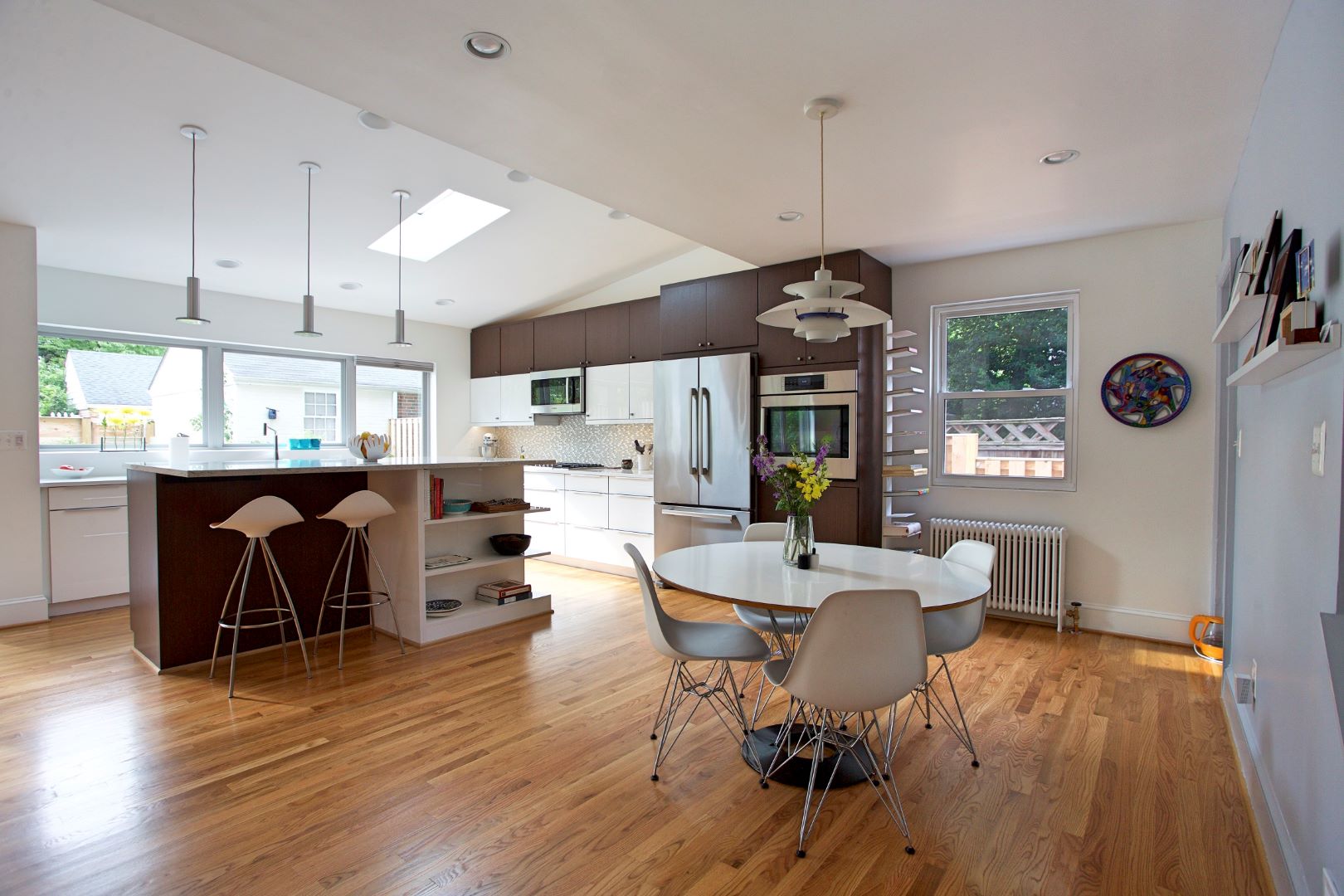 Detail of kitchen featuring modern appliances, premium countertops, and Mid-Century influenced design elements