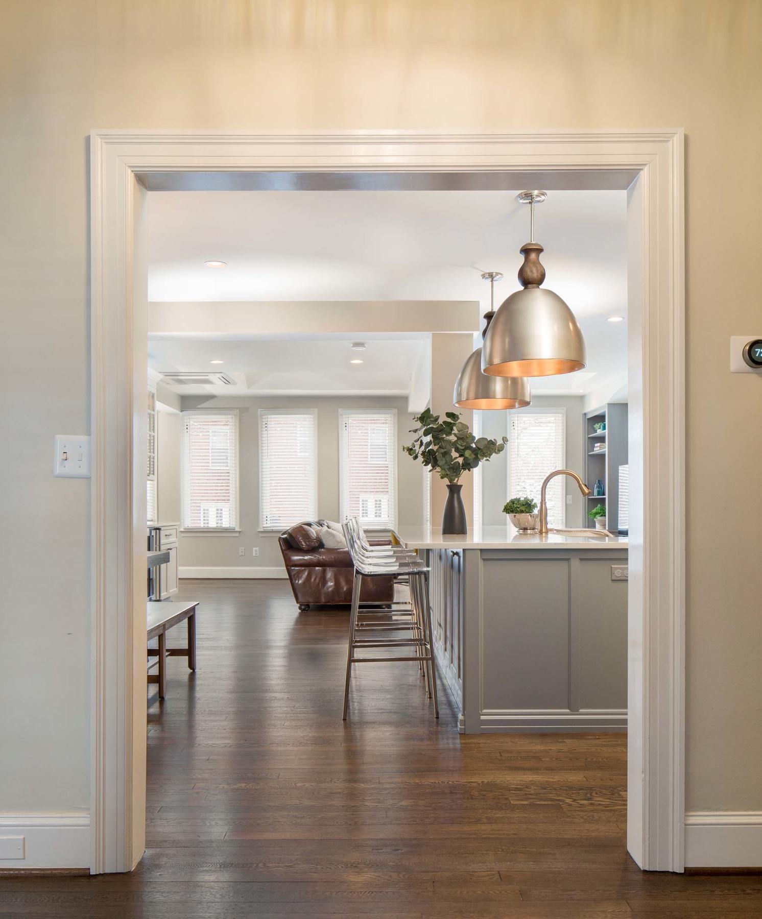 Living area showcasing seamless integration with kitchen after removal of load-bearing wall and steel beam installation
