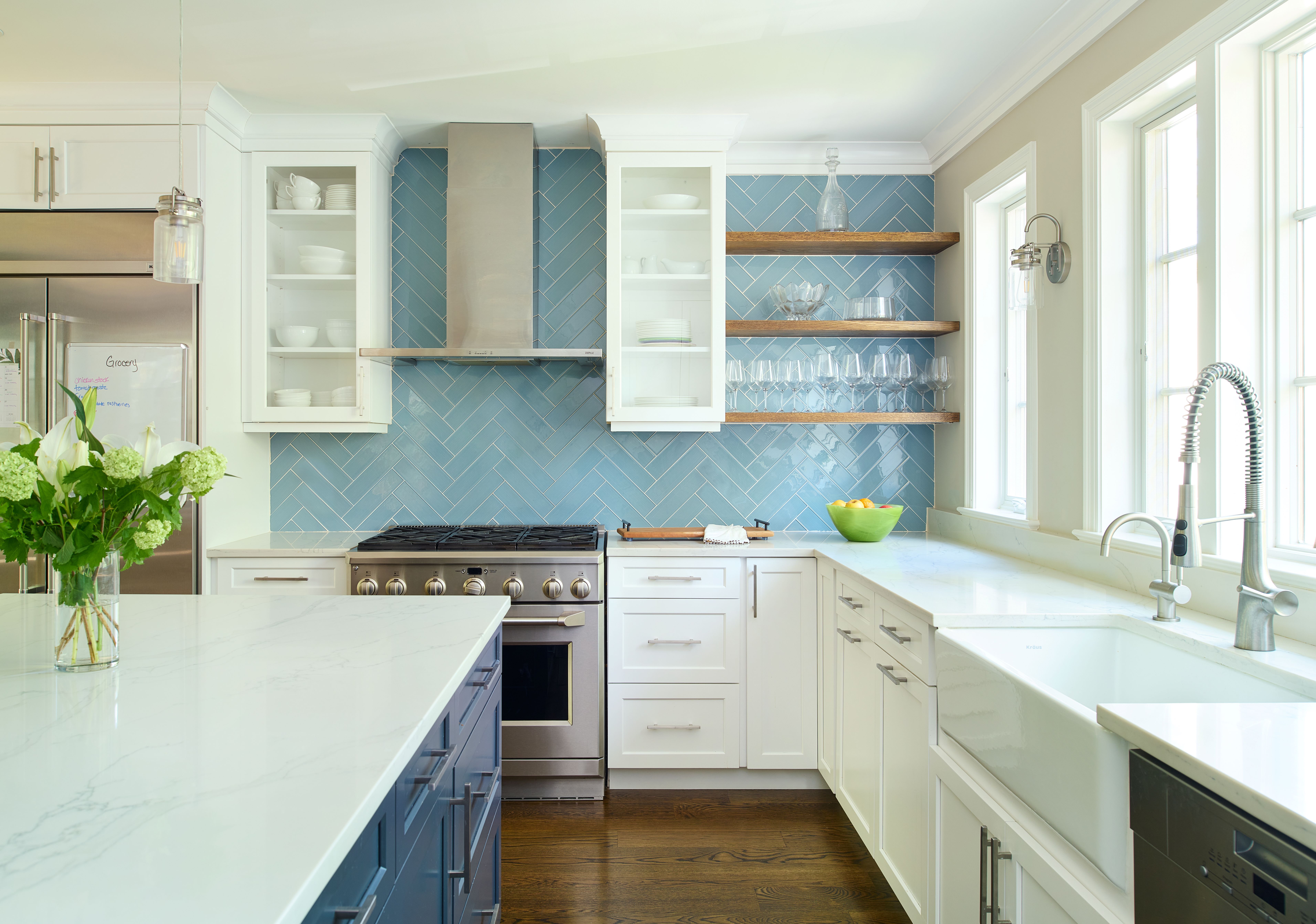 Kitchen island featuring quality countertops, comfortable seating, and functional workspace in renovated home