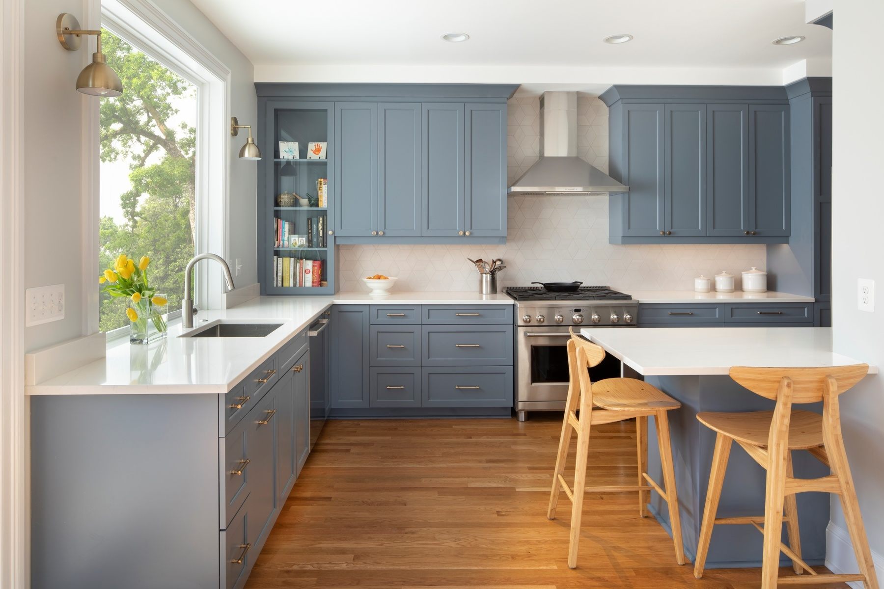 L-shaped kitchen featuring warm wood tones, premium appliances, and thoughtful storage solutions in DC home
