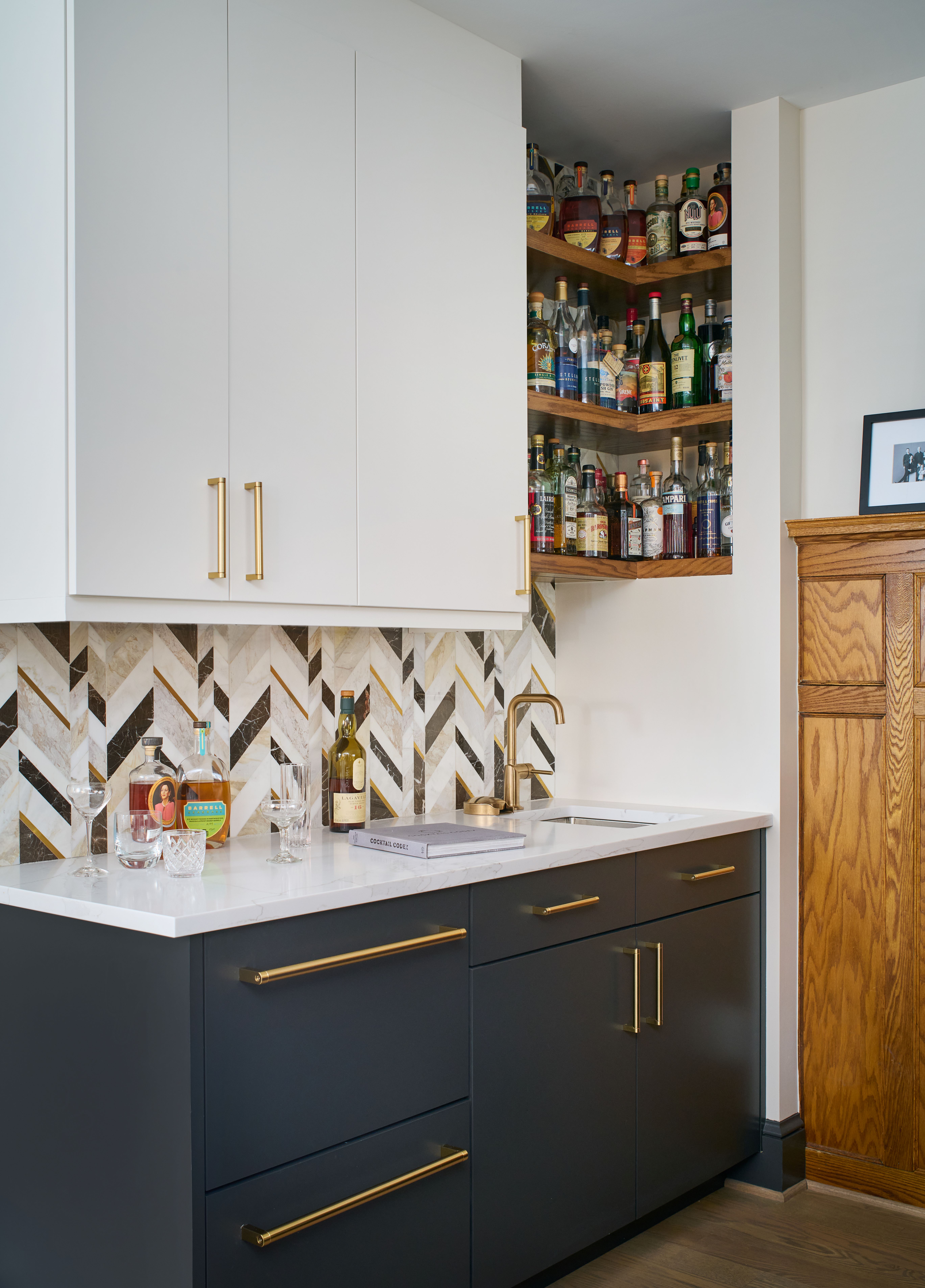 Kitchen view showing connection to dining room and thoughtful placement of modern double ovens