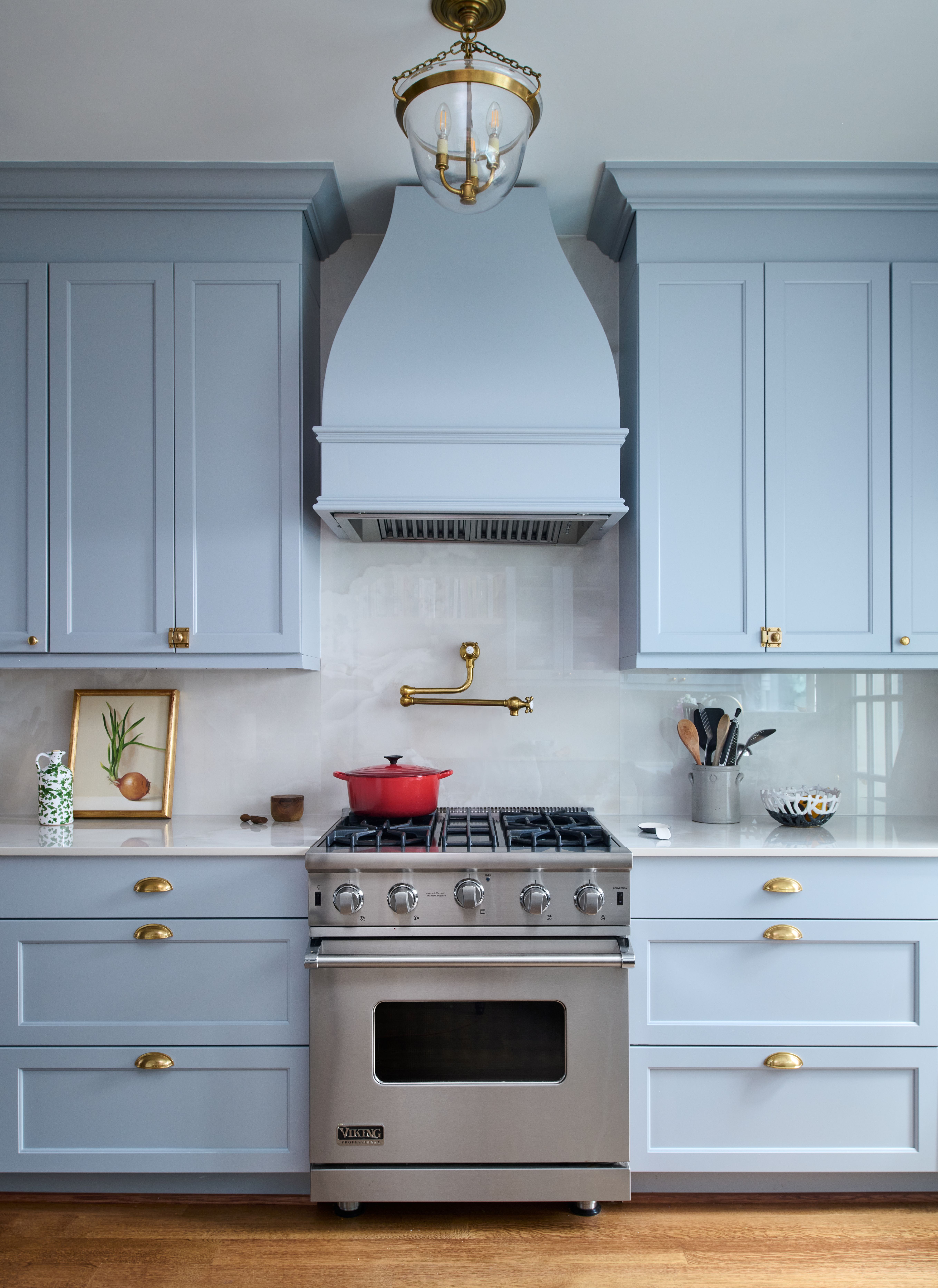Modern rowhouse kitchen featuring white cabinetry, premium appliances, and optimized layout in Old City renovation