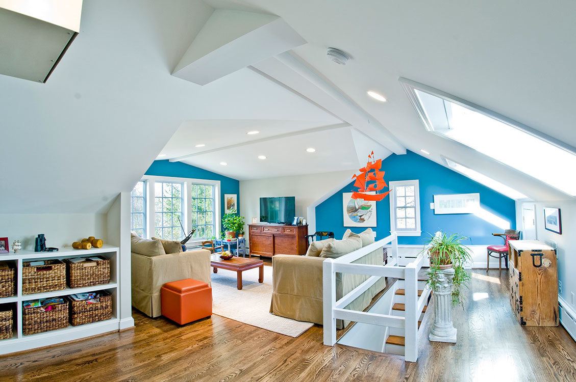 Renovated attic living space with large gable dormer providing panoramic views of the Potomac River and abundant natural light