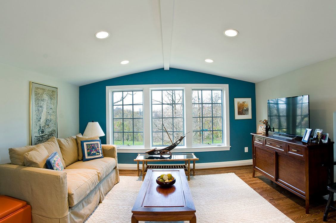 Custom built-in shelving and storage solutions integrated into attic renovation for functionality and style