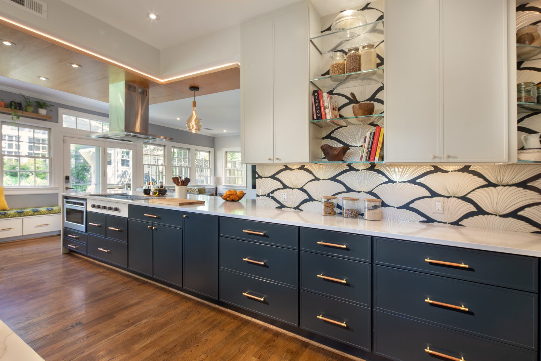 Modern kitchen featuring premium appliances, designer pendant lighting, and sophisticated color palette