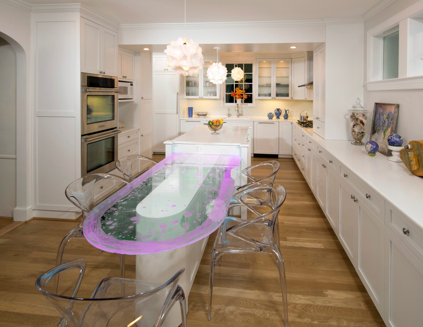 LED-lit glass table displaying different color mode, showcasing versatility of the custom lighting feature