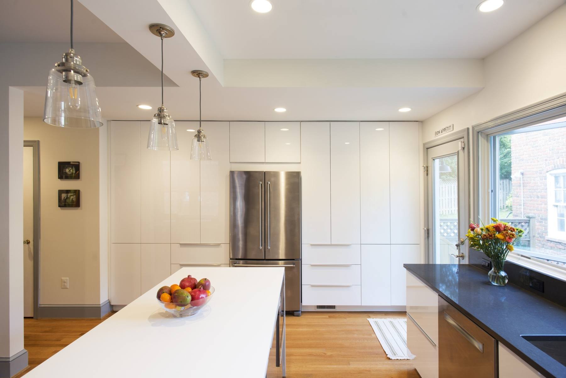 Kitchen detail showing custom cabinetry, high-end appliances, and thoughtful design elements in reimagined layout