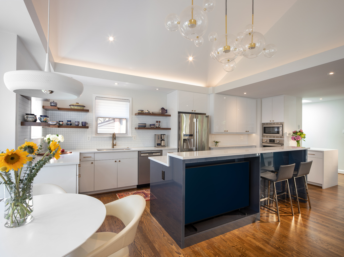 Panoramic view of renovated Bethesda kitchen featuring contemporary design, cobalt blue island accent, and premium finishes