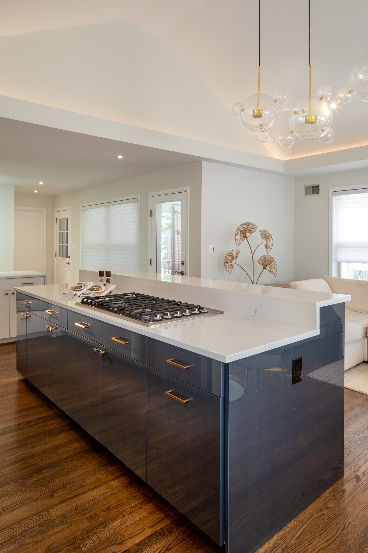 View of renovated kitchen highlighting improved layout, efficient storage solutions, and stylish backsplash design