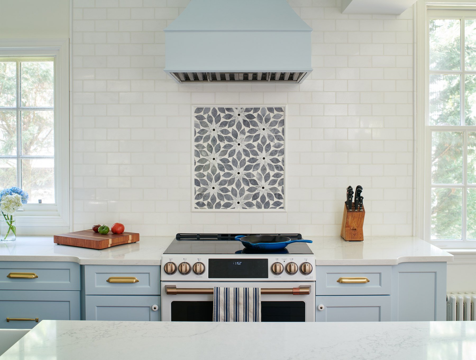 Contemporary Crestwood kitchen featuring sleek cabinetry, modern induction cooktop, and optimized layout in refreshed DC home