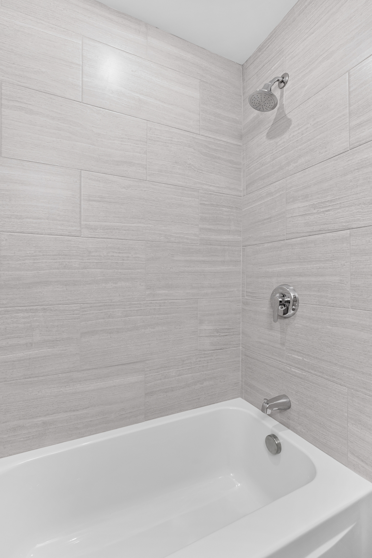 Powder room featuring stylish wallpaper, elegant lighting, and sophisticated fixtures in historic co-op