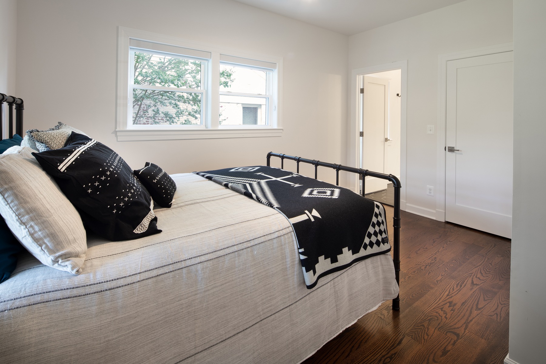 Second floor bedroom showcasing clean design, abundant natural light, and functional layout for growing family