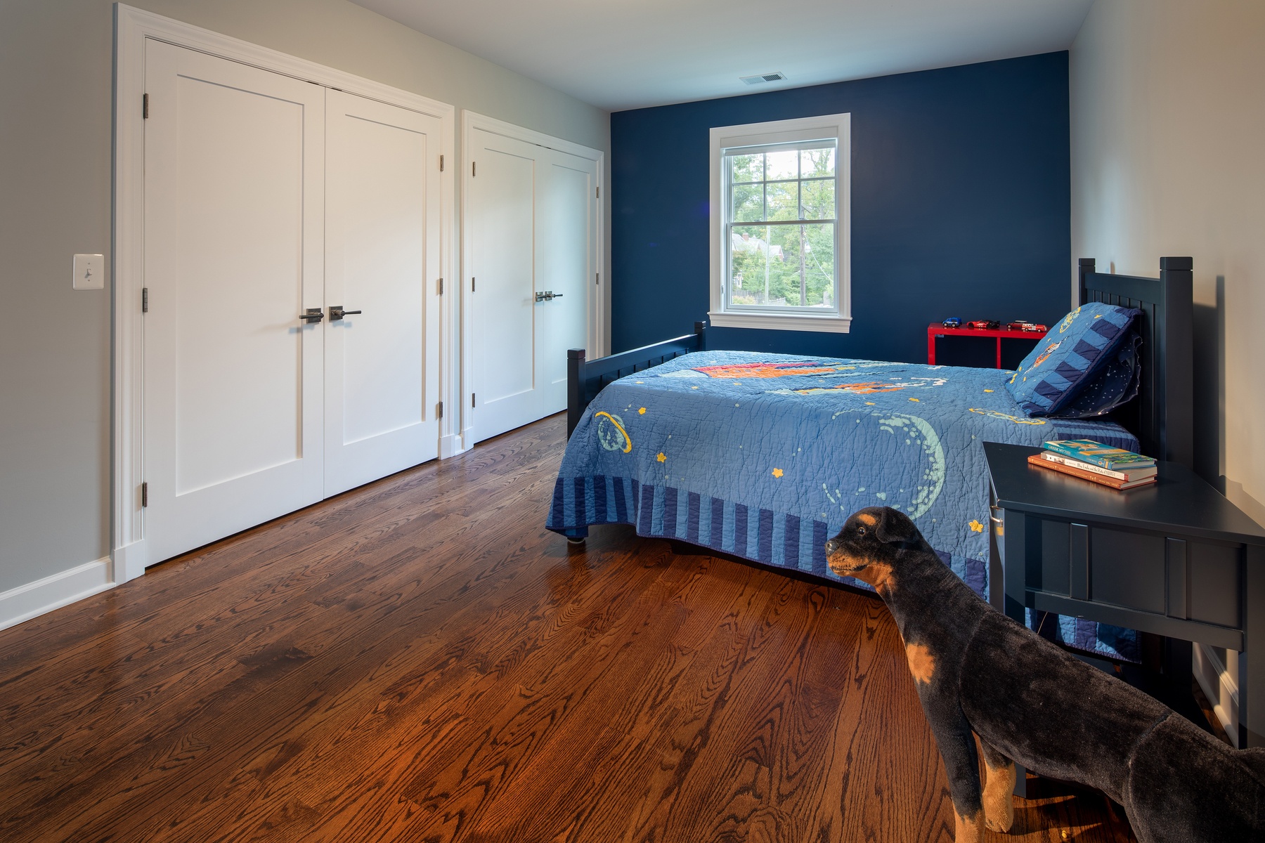 Another second floor bedroom with custom closet space, contemporary finishes, and abundant natural light