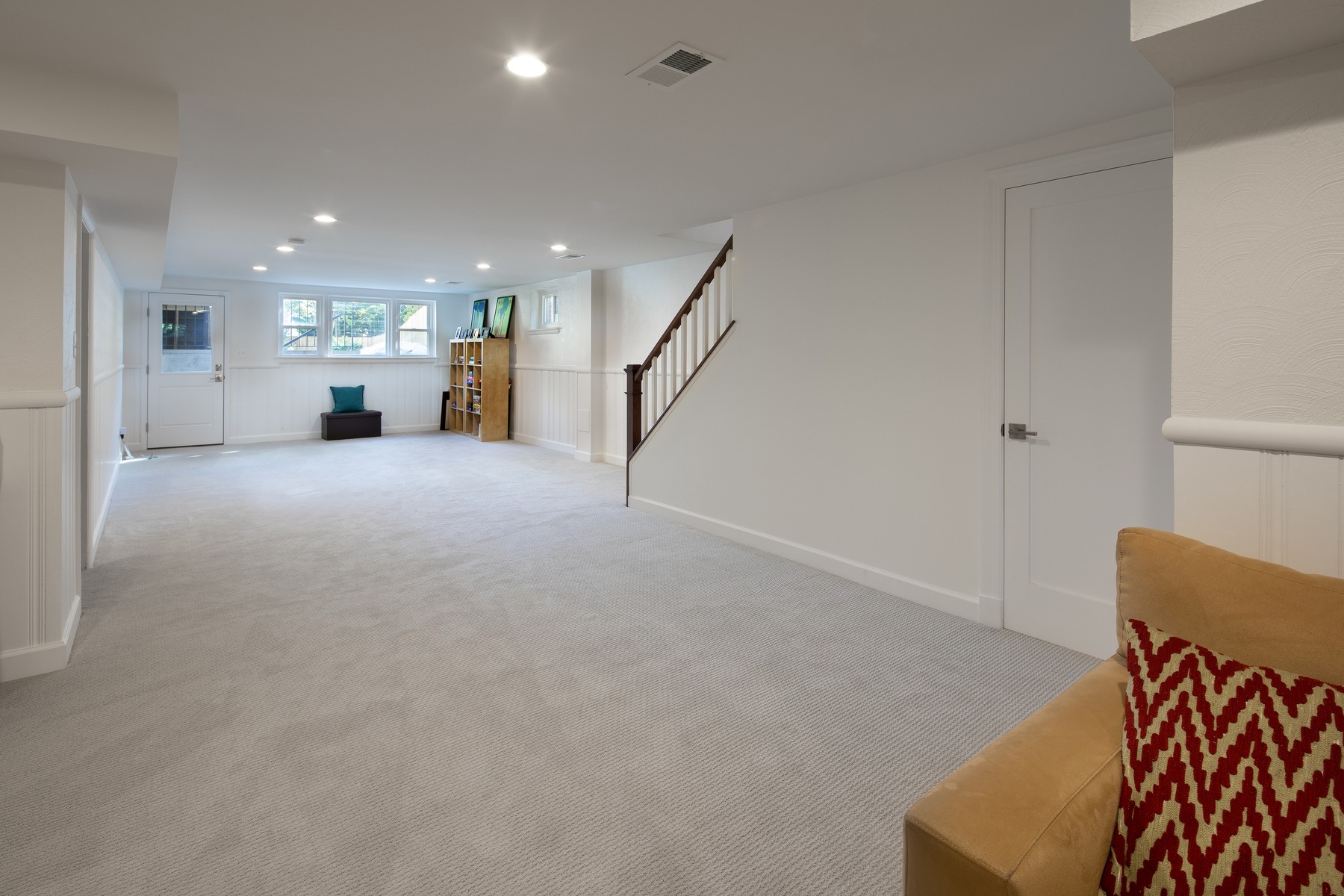 Dining area adjacent to kitchen featuring contemporary furnishings, strategic lighting, and connection to living spaces