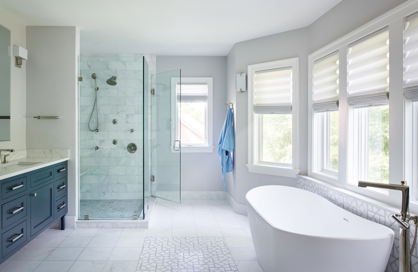 Primary bathroom in Colonial Village home featuring spa-like design, elegant fixtures, and seamless integration with historic architecture
