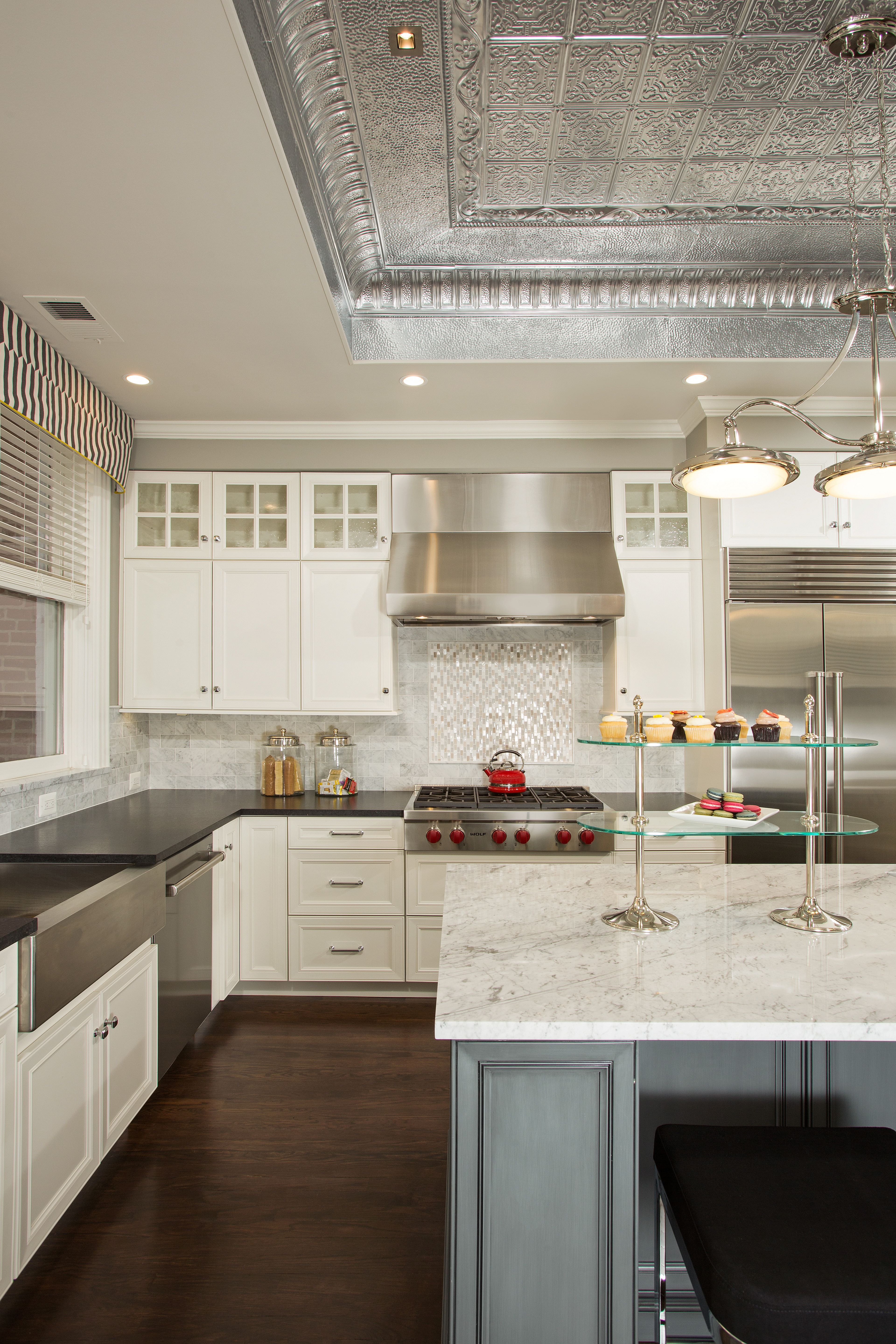 Professional-grade range with stylish backsplash, decorative display, and thoughtful design details in renovated kitchen