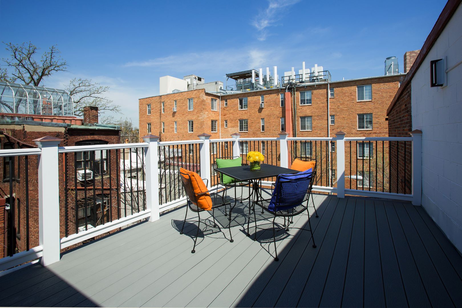 Right-side view of rear deck addition showcasing outdoor living space, quality construction, and connection to interior