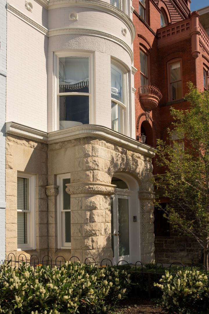 Front view of Capitol Hill home showcasing architectural details, thoughtful restoration, and sunlit facade