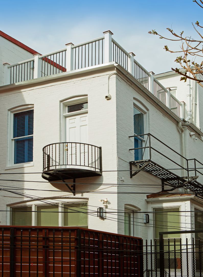 Balcony detail of renovated Capitol Hill home featuring custom railings, durable materials, and thoughtful design