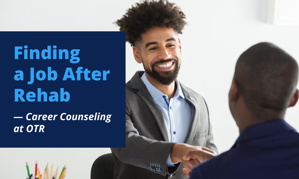 african american shaking hands with another man during job interview