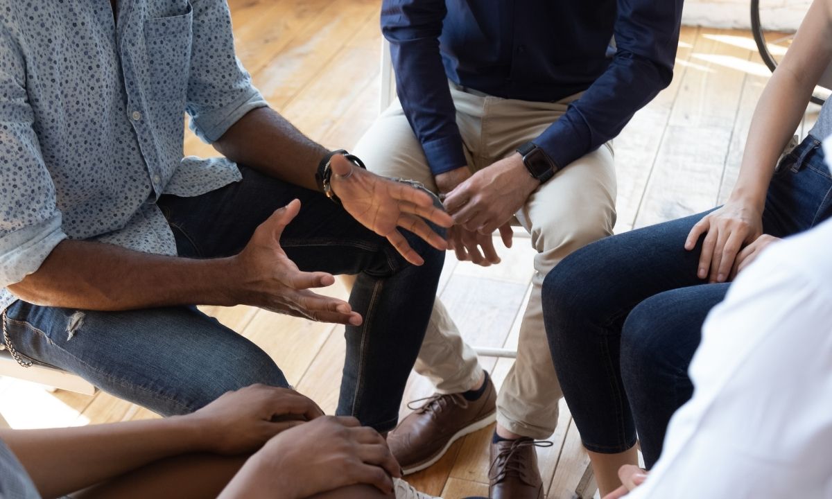 group of individuals celebrating recovery success rate