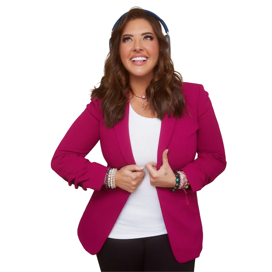 Smiling woman with brown hair wearing a magenta blazer over a white top and bracelets on both wrists.