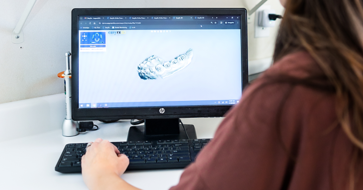 orthodontic tech works on computer with EasyRx